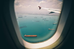 View of turquoise water and islands from an airplane window