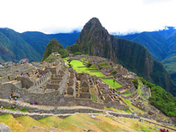 Machu Picchu ruins surrounded by green mountains