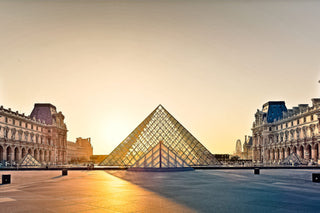The Louvre Pyramid at sunrise in Paris