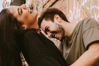 Couple laughing together outdoors