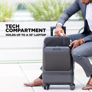 NOMATIC Carry-On Executive, lifestyle photo of a man opening the front tech compartment that holds up to a 16-inch laptop