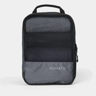 NOMATIC medium Compression Packing Cube in gray, mesh top showing packed clothing
