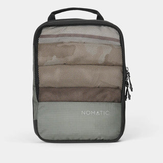NOMATIC medium Compression Packing Cube in moss, mesh top showing packed clothing