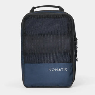 NOMATIC medium Compression Packing Cube in navy, mesh top showing packed clothing