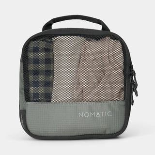NOMATIC small Compression Packing Cube in moss, mesh top showing packed clothing