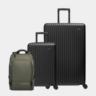 Set of black suitcases and a green backpack on a light gray background#color_black