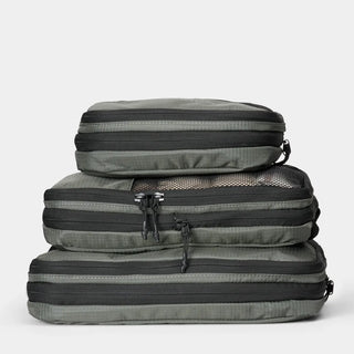 NOMATIC Compression Packing Cubes in moss, compressed and stacked, top view