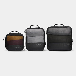 NOMATIC Compression Packing Cubes in black, three sizes shown side by side