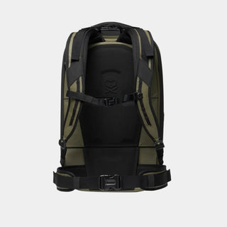 The back view of a technical backpack in black and olive green, featuring padded shoulder straps, a central support panel with a molded logo, and a compression buckle system, set against a plain white background.