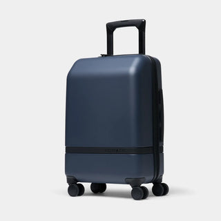 NOMATIC Carry-On Classic in navy, front three-quarter product view with handle extended