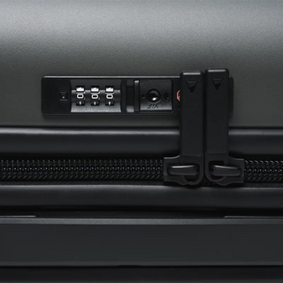 NOMATIC Carry-On Classic in olive, close-up detail of the integrated TSA lock and zipper pull